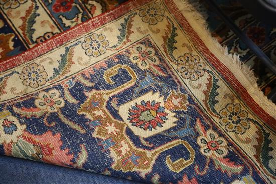 A Heriz ivory and blue ground carpet, 13ft by 10ft